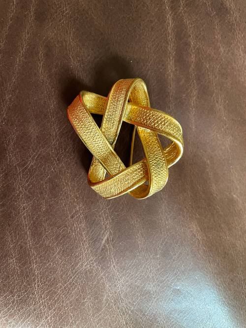 Broche noeud Claude Montana excellent état
