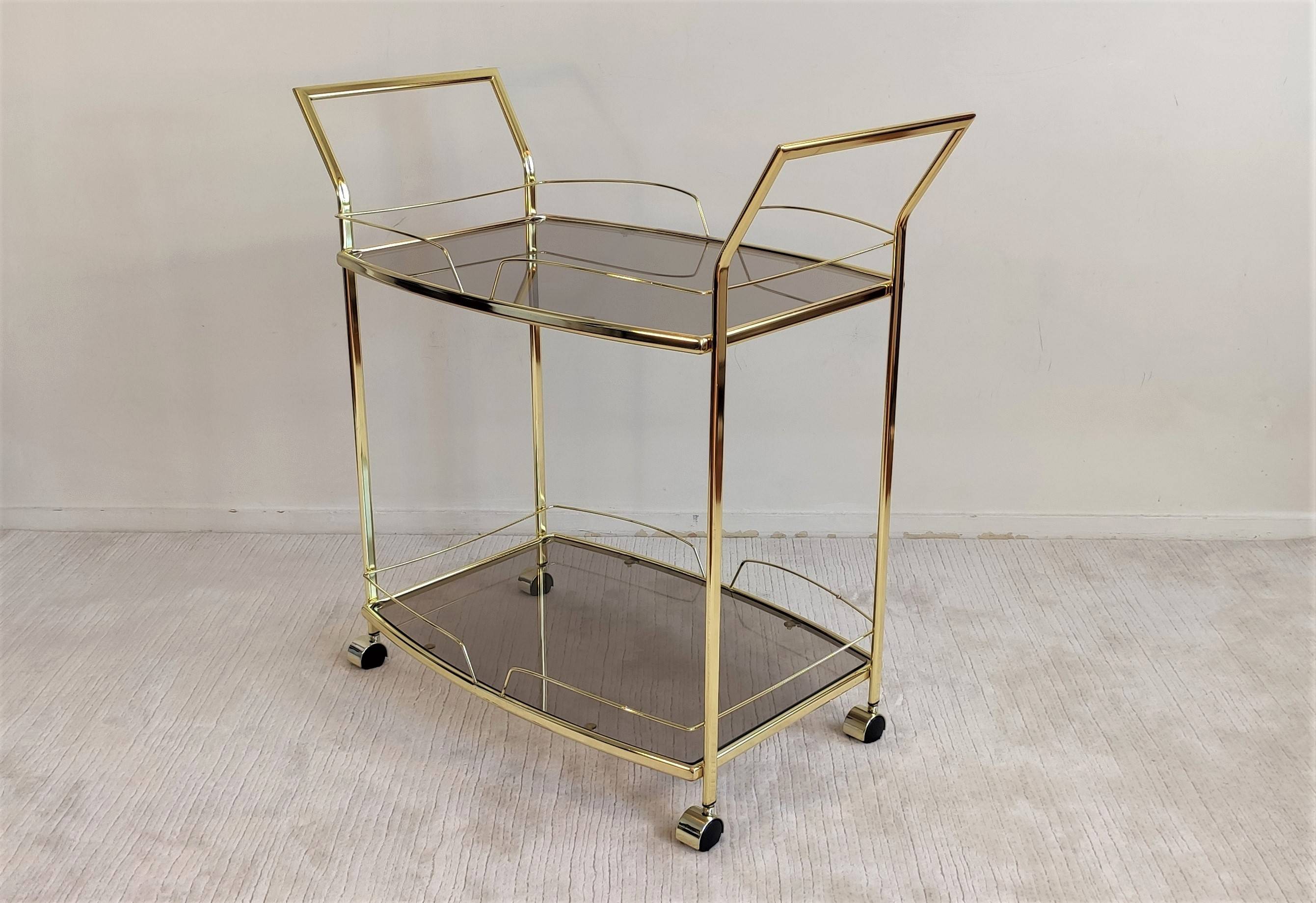 Très belle desserte bar trolley dorée à roulettes, en laiton doré des