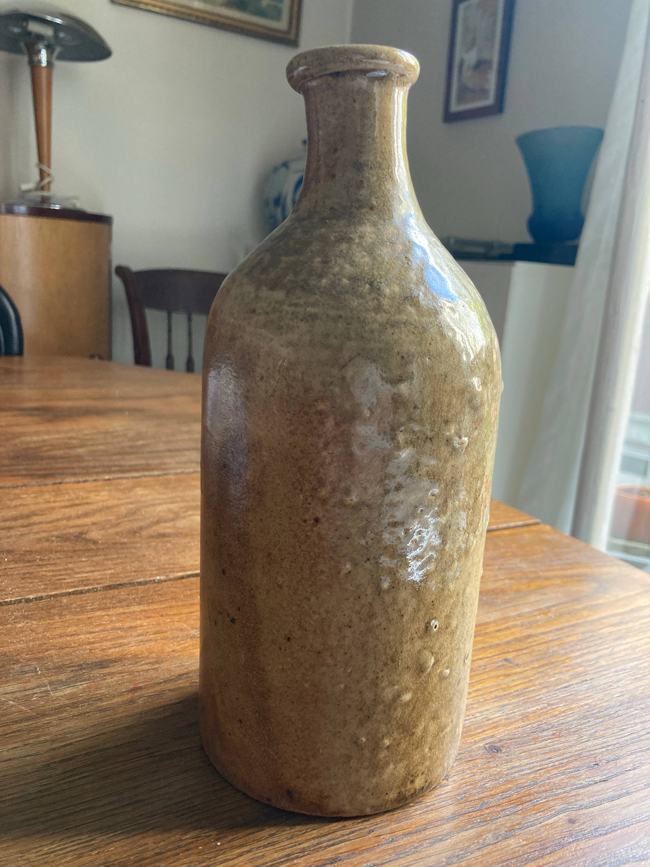 Vends bouteille ancienne en grès