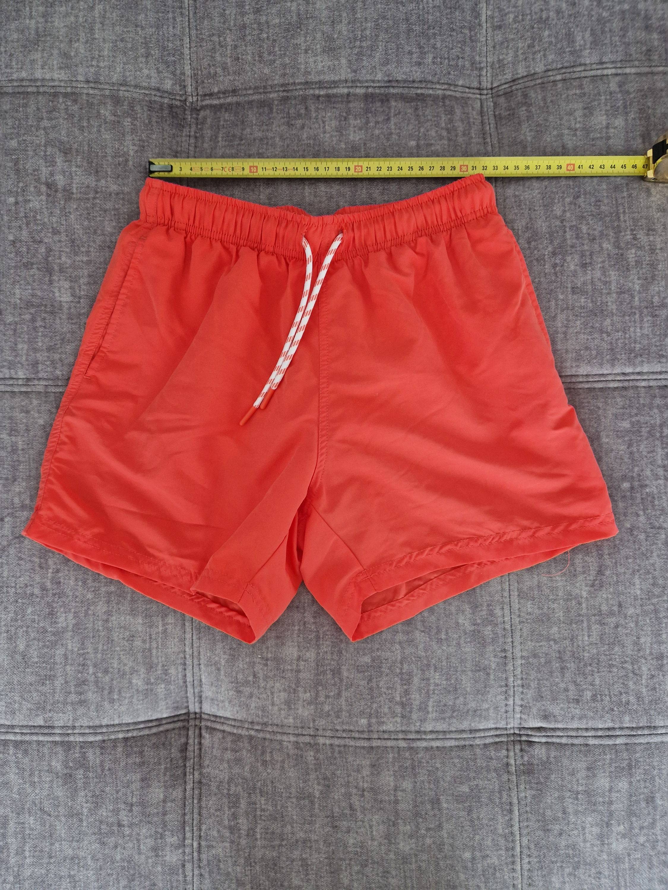 Vends short de bain garçon doublé avec poches rouge orangé - Taille 14 ans