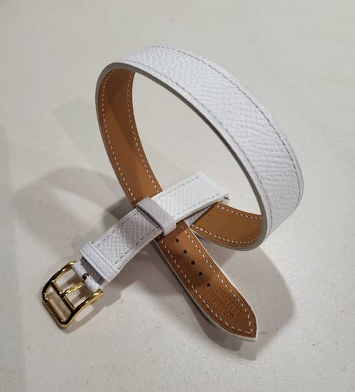 Vends bracelet Hermès double tour cuir grainé blanc avec sa boucle dorée pour montre Hermès modèle "Heure H"