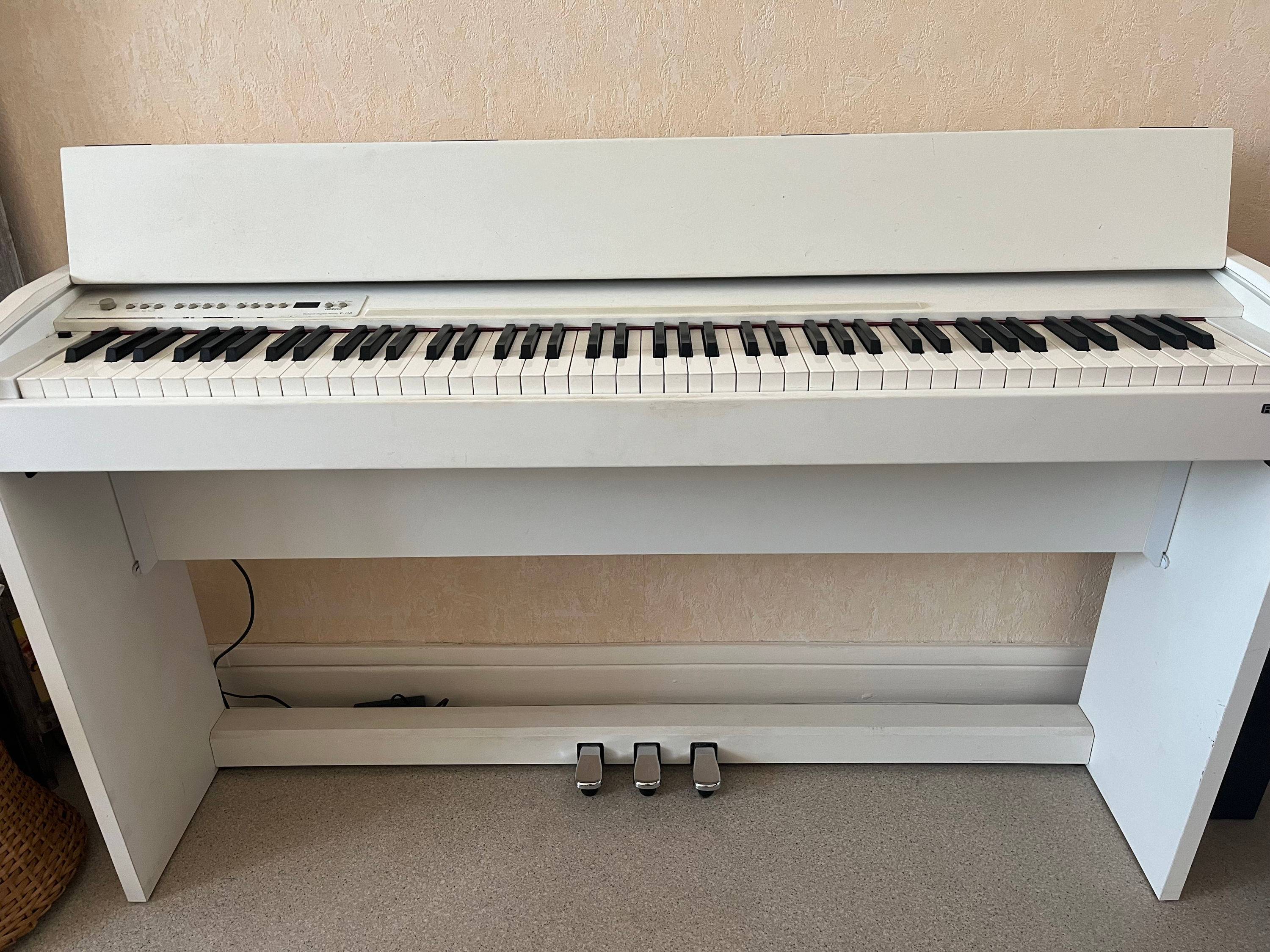 Vends piano droit électrique d’occasion