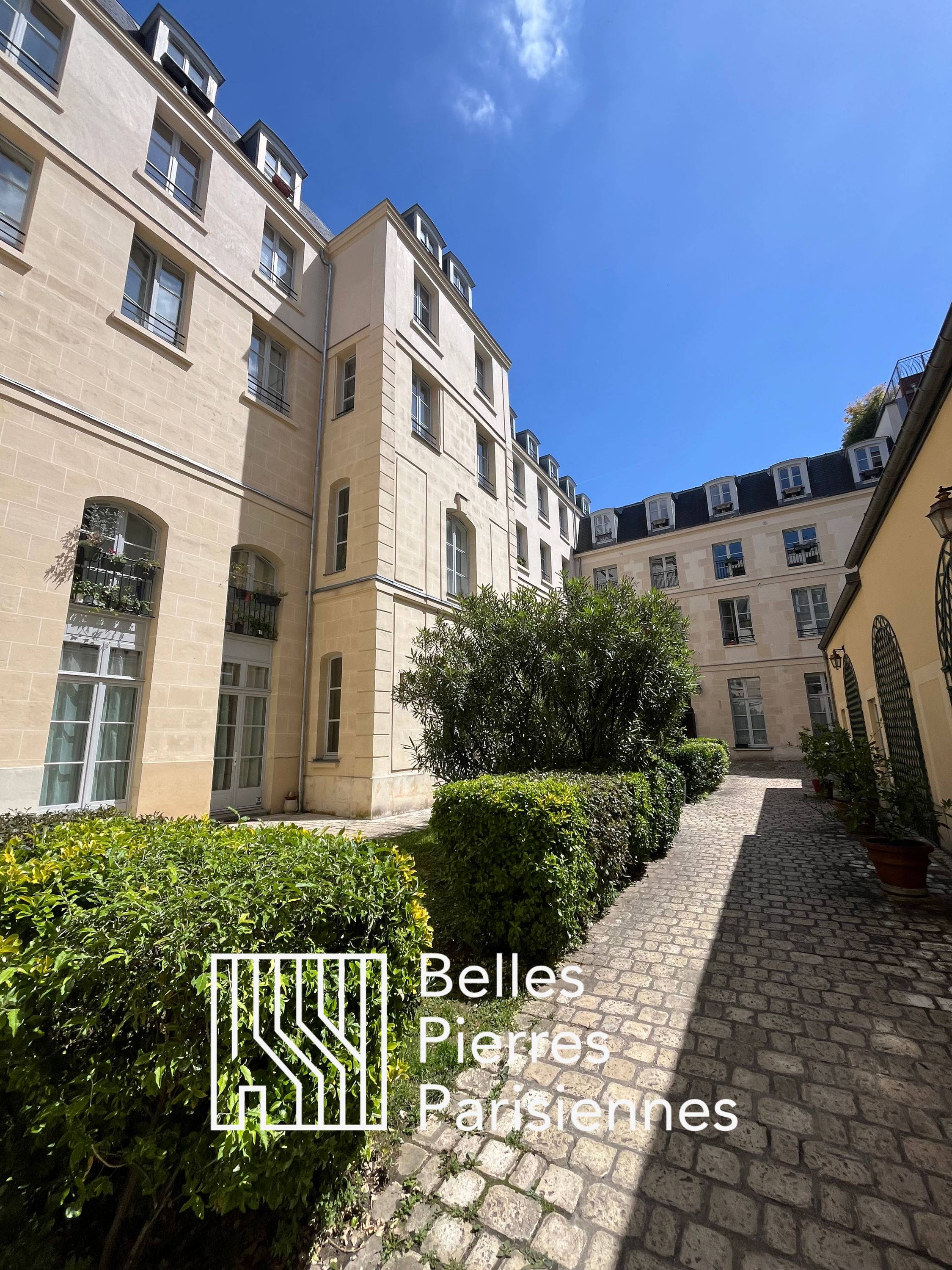 Vends appartement sur cour et jardin paysagé - 54m²