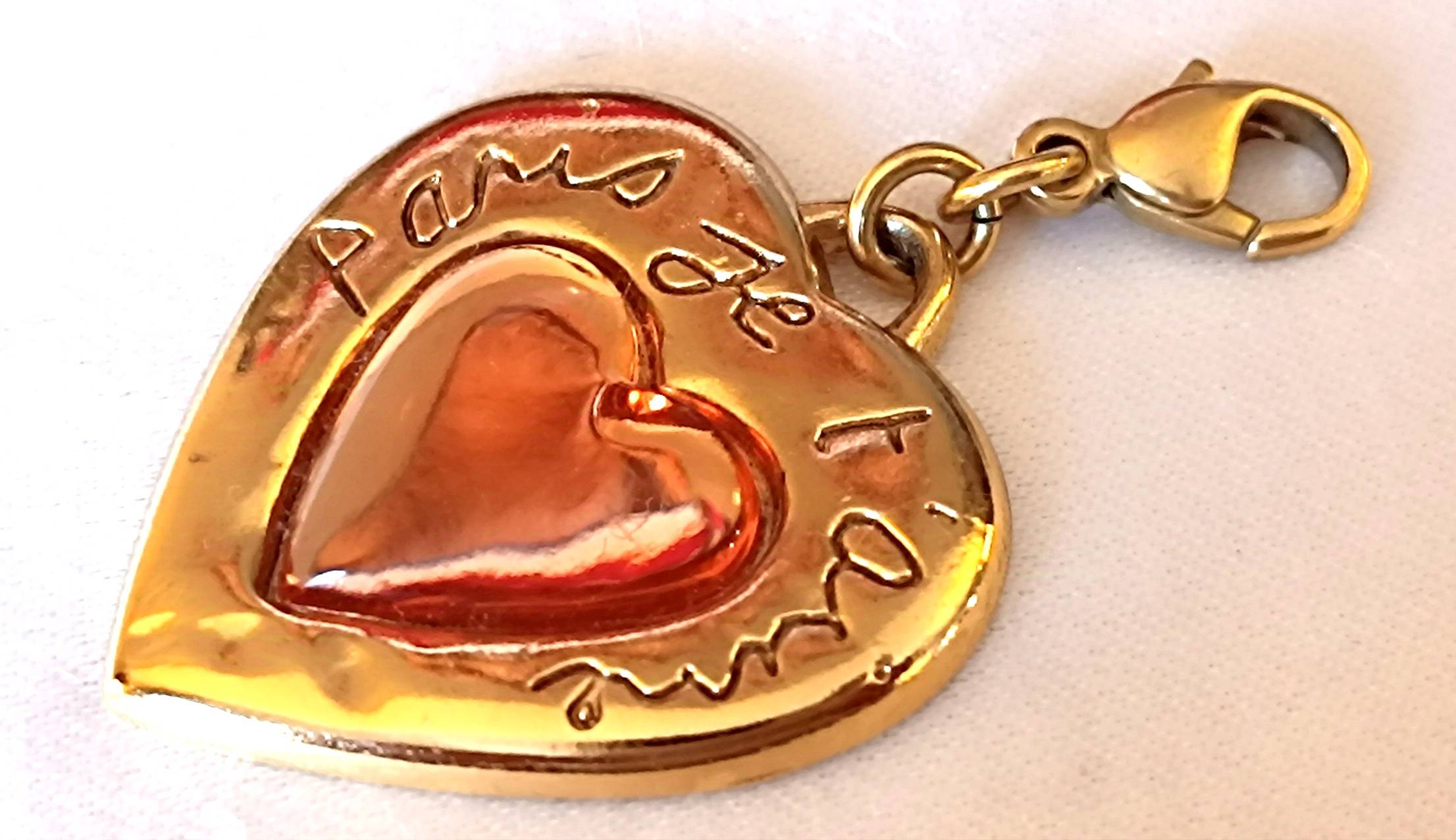 Vends pendentif cœur "Paris je t’aime" Yves Saint Laurent - doré
