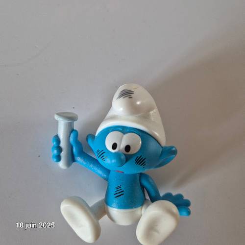 Schtroumpf apprentie avec verre de chimiste