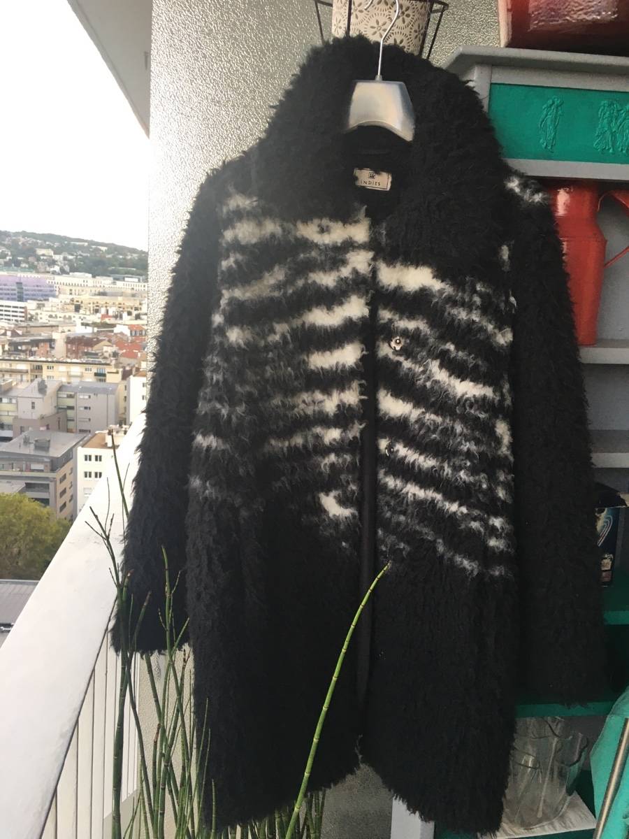 Vends manteau Indies fausse fourrure noir et blanc