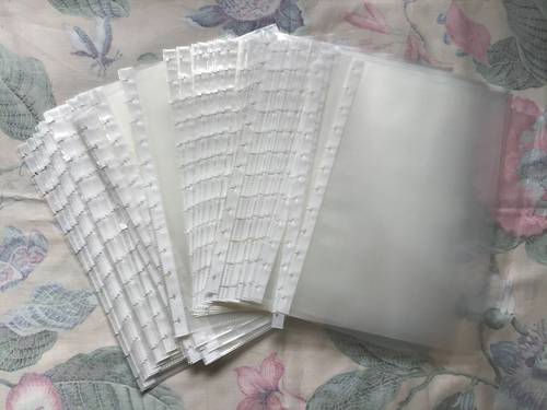 Vends 80 pochettes plastiques détachables pour protéger des documents à anneaux