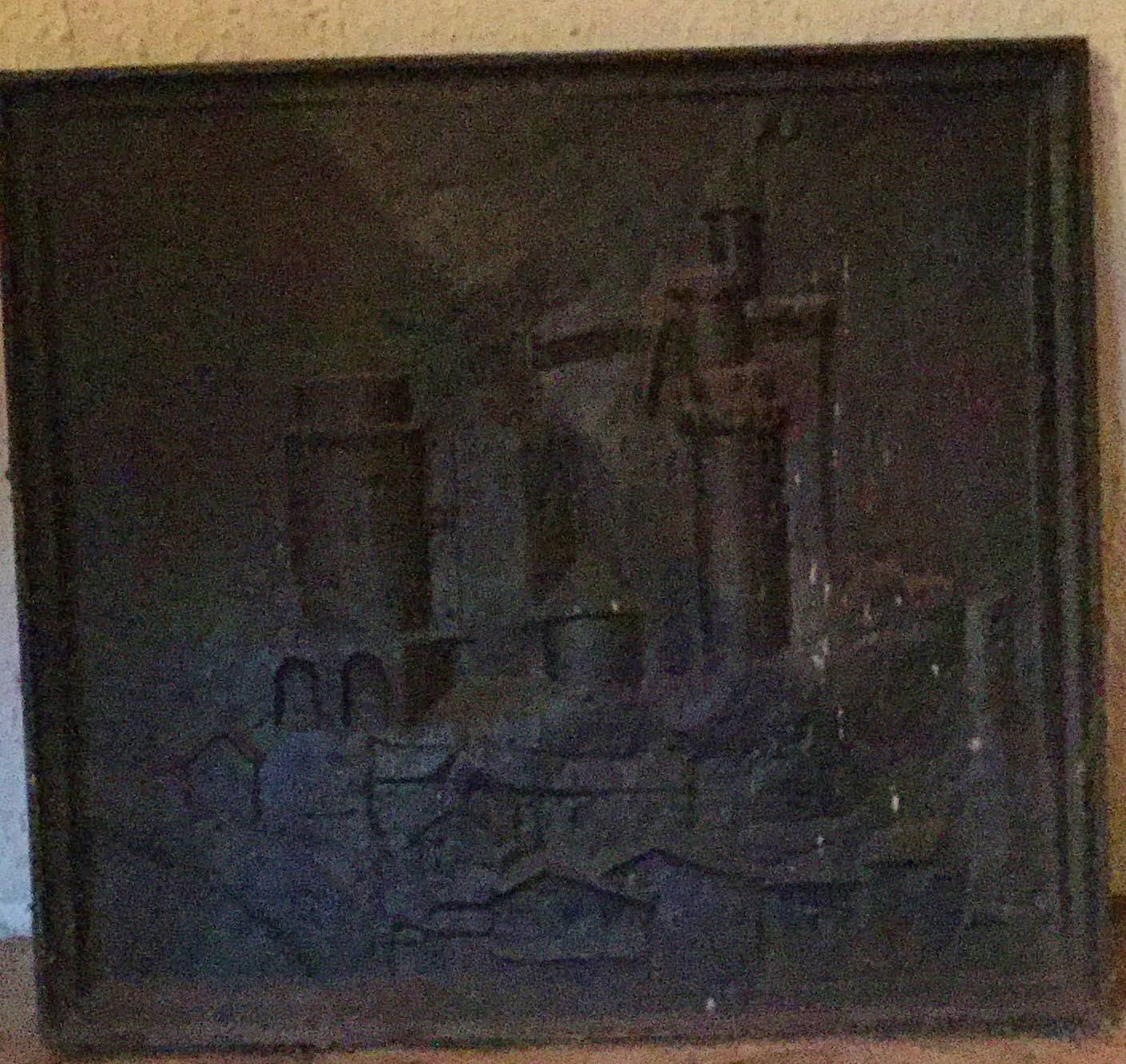 Ancienne petite plaque de cheminée en fonte représentant un angelot